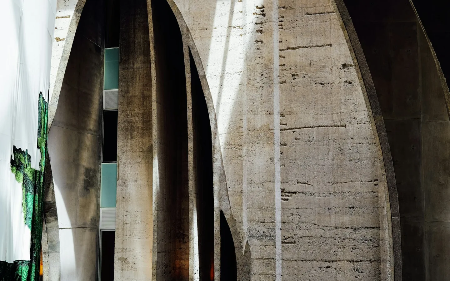 Concrete architectural forms shaped by dramatic light and shadow