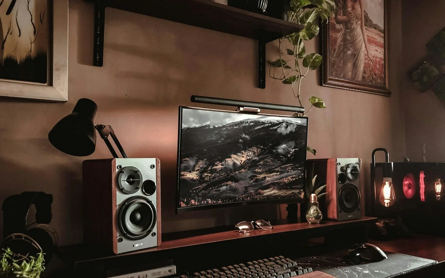 A creative workstation with a computer, camera and keyboard