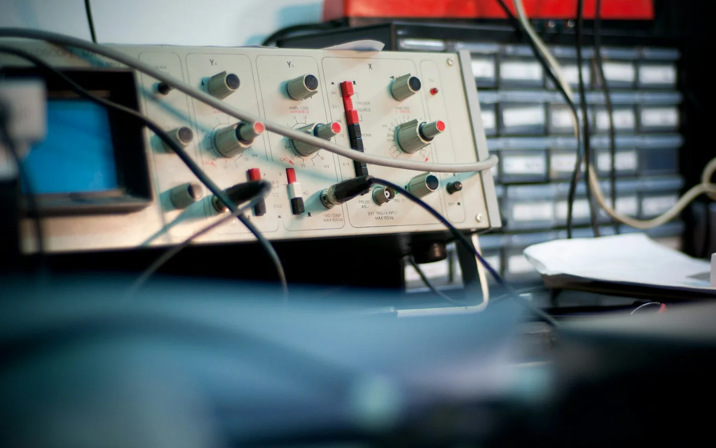 An oscilloscope on an electronics workbench